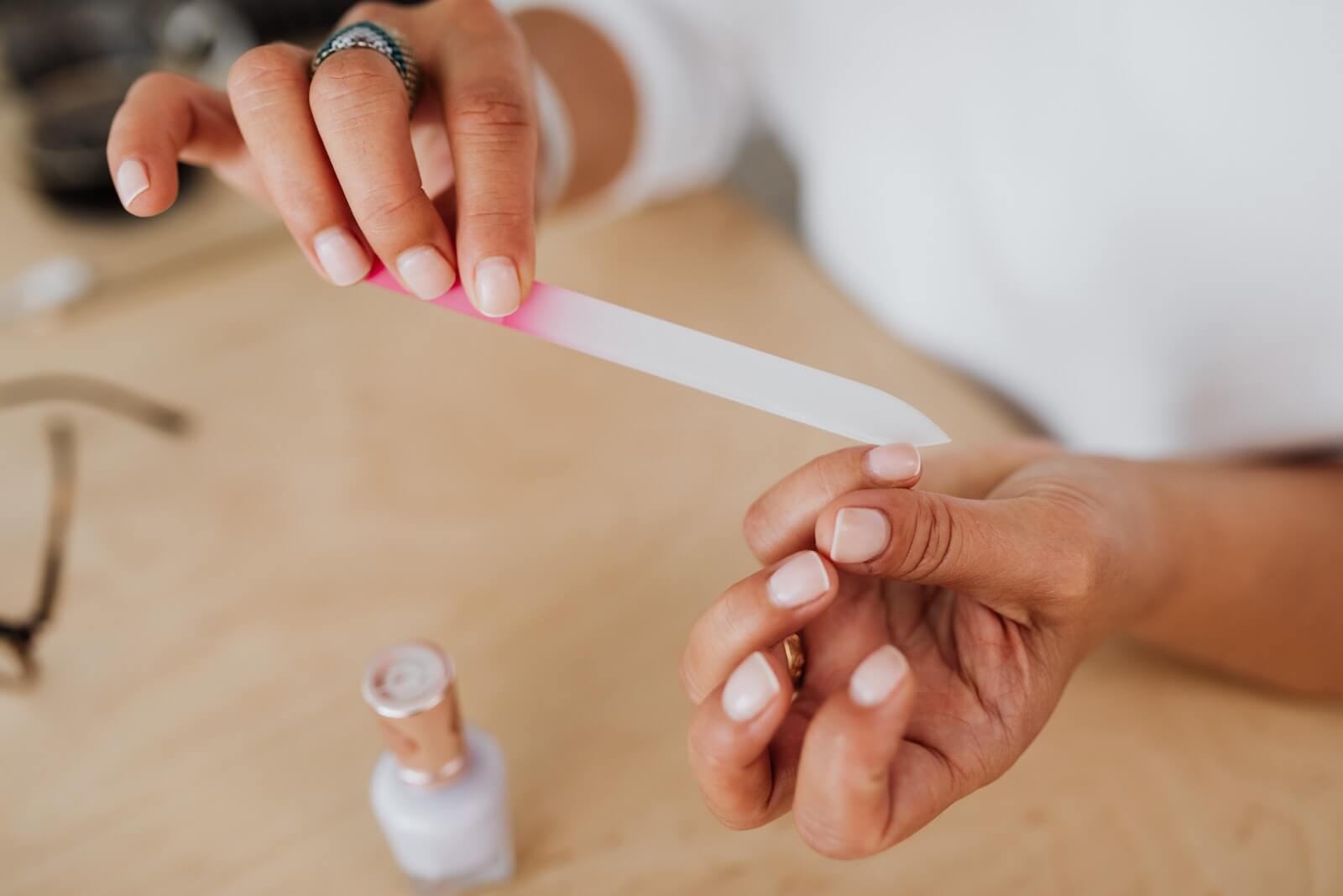 A person filing their nails