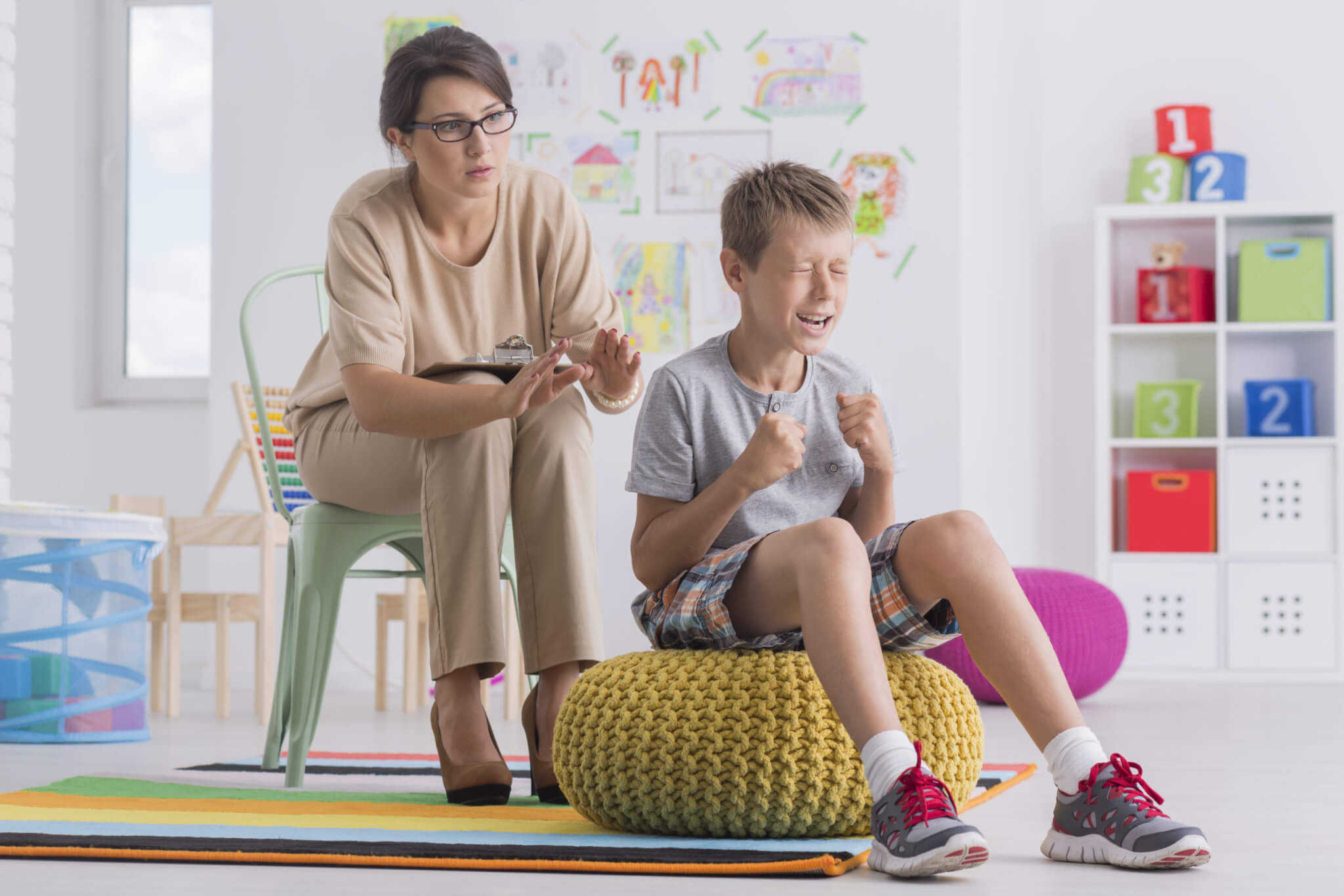 Angry, violent child having temper tantrum