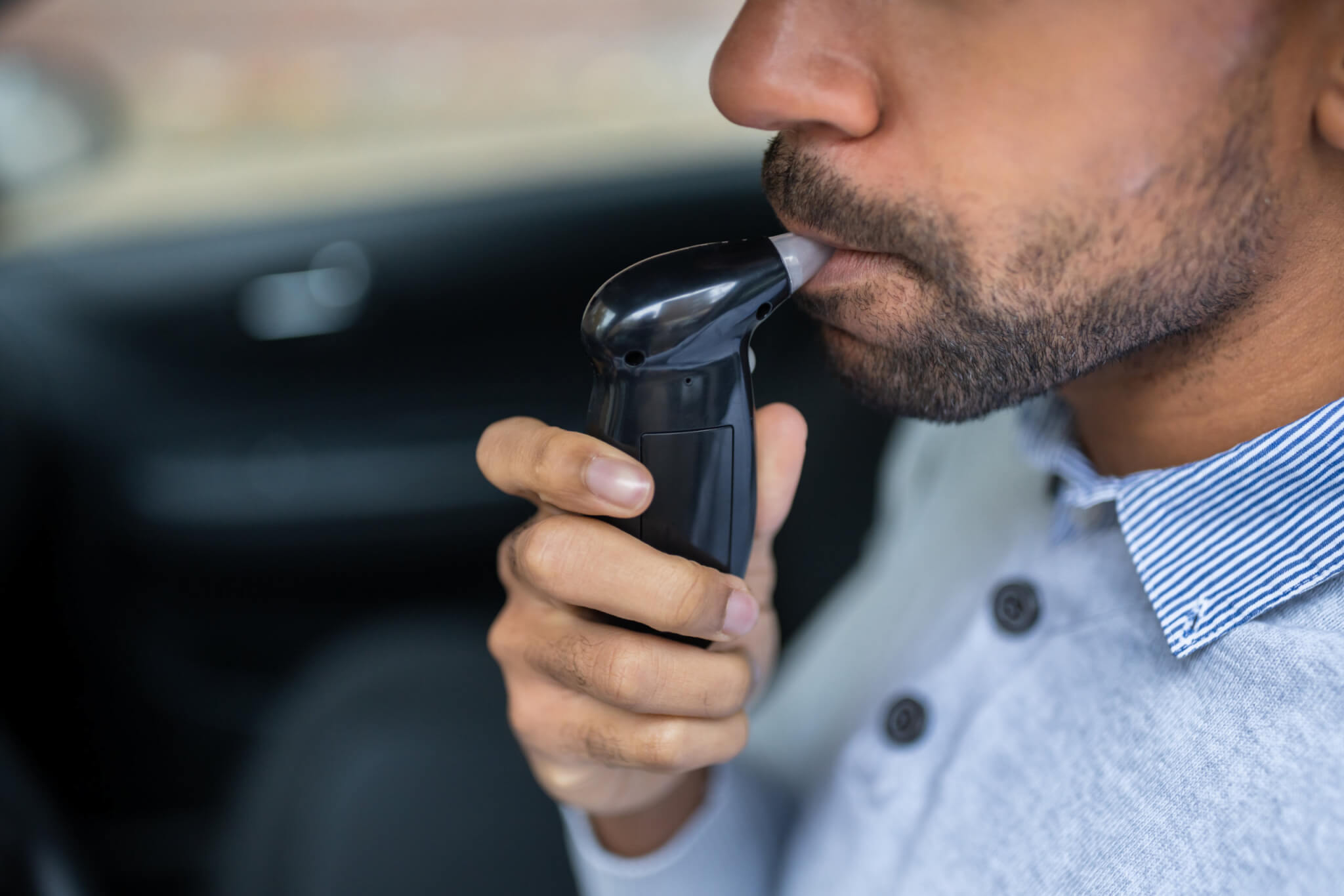 Man taking breathalyzer test