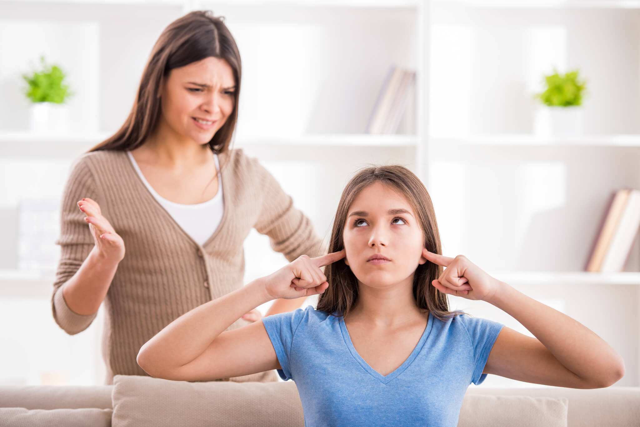 Teen daughter ignoring her mother