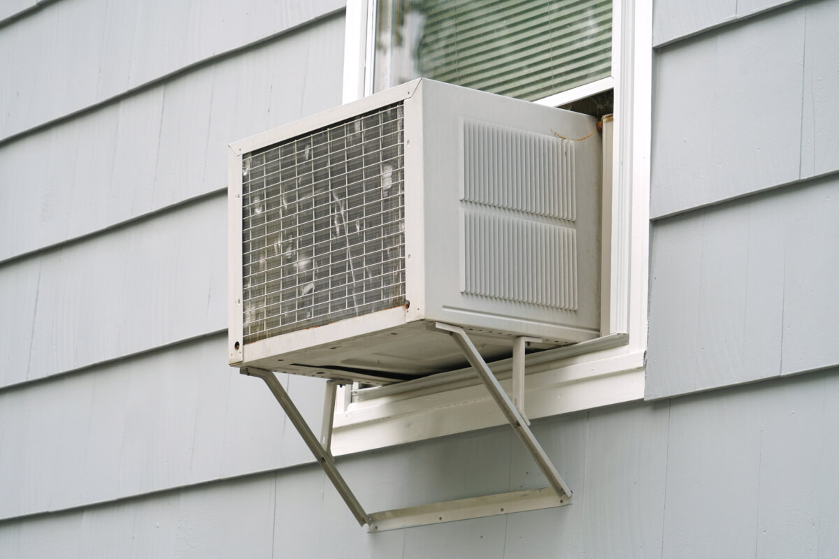 old air conditioner installed in house window