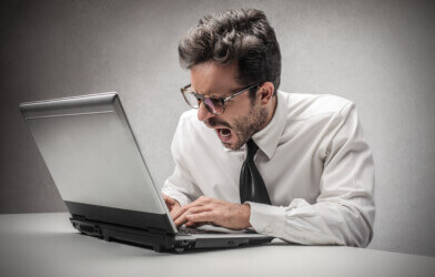 angry businessman writing an email