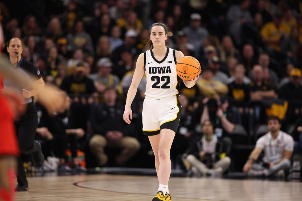 Caitlin Clark dribbles the ball during the Big Ten tournament.