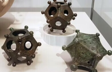 Two dodecahedra and an icosahedron on display in the Rheinisches Landesmuseum Bonn, Germany.