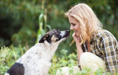 Dog giving its owner a kiss