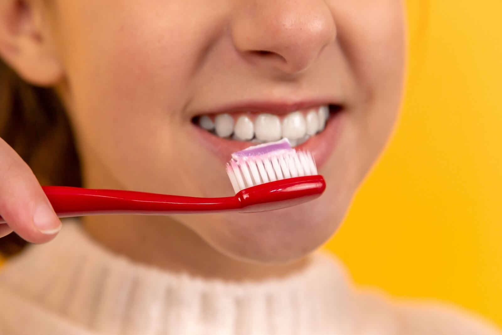 girl with toothbrush and toothpaste