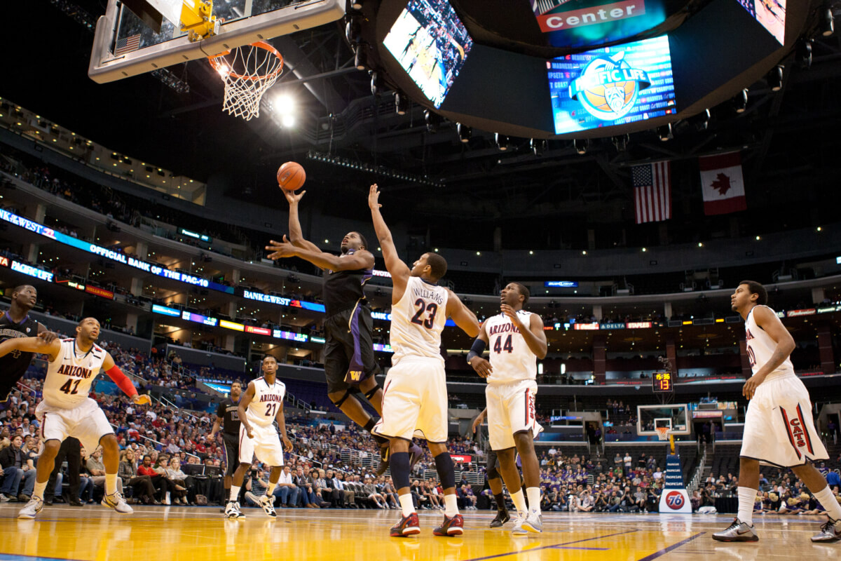 LOS ANGELES - MARCH 12: Washington Huskies F Matthew Bryan-Amaning #11 lays the ball up during the NCAA Pac-10 Tournament basketball championship game on March 12 2011 at Staples Center in Los Angeles, CA.