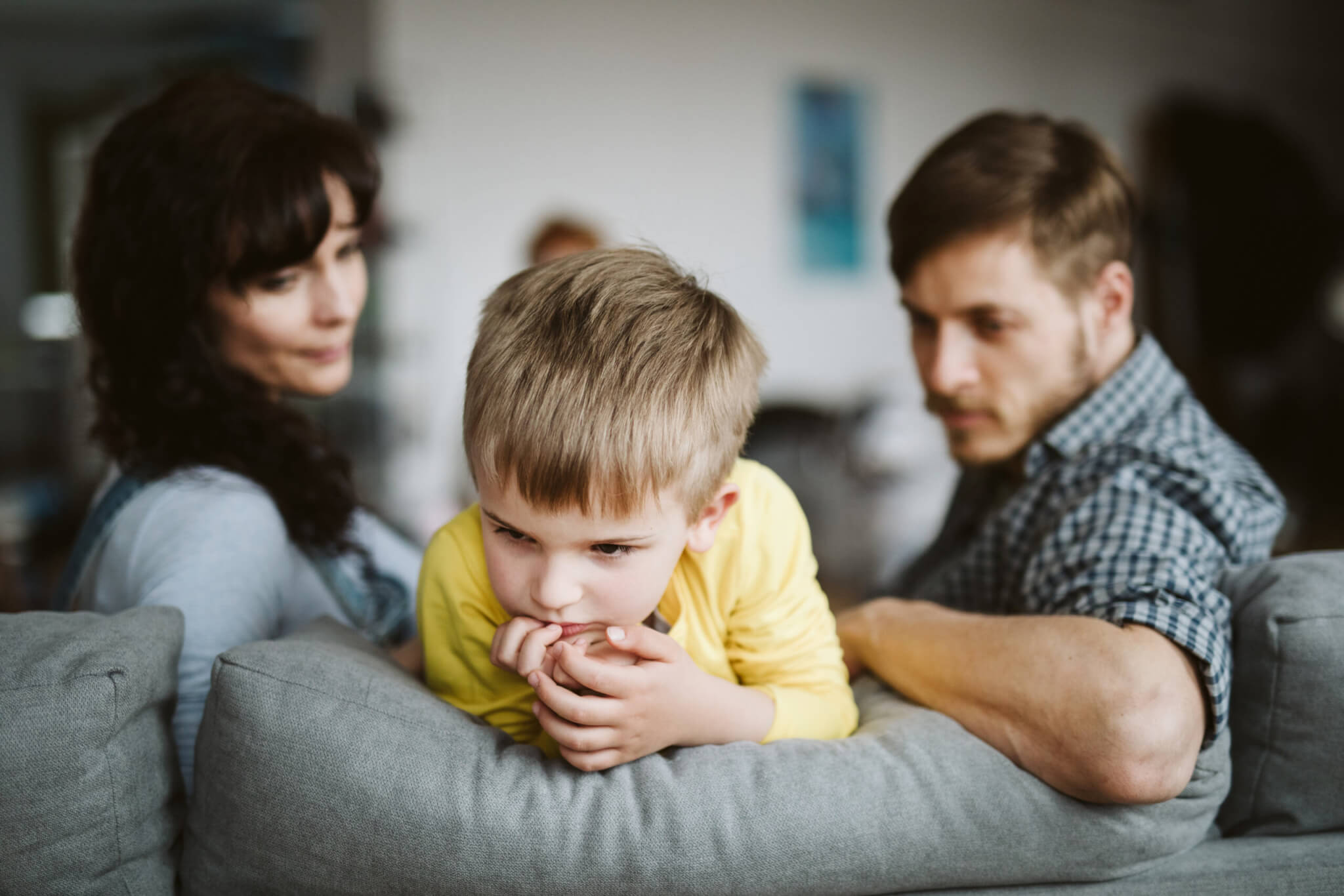 Parents disciplining talking to child after bad behavior