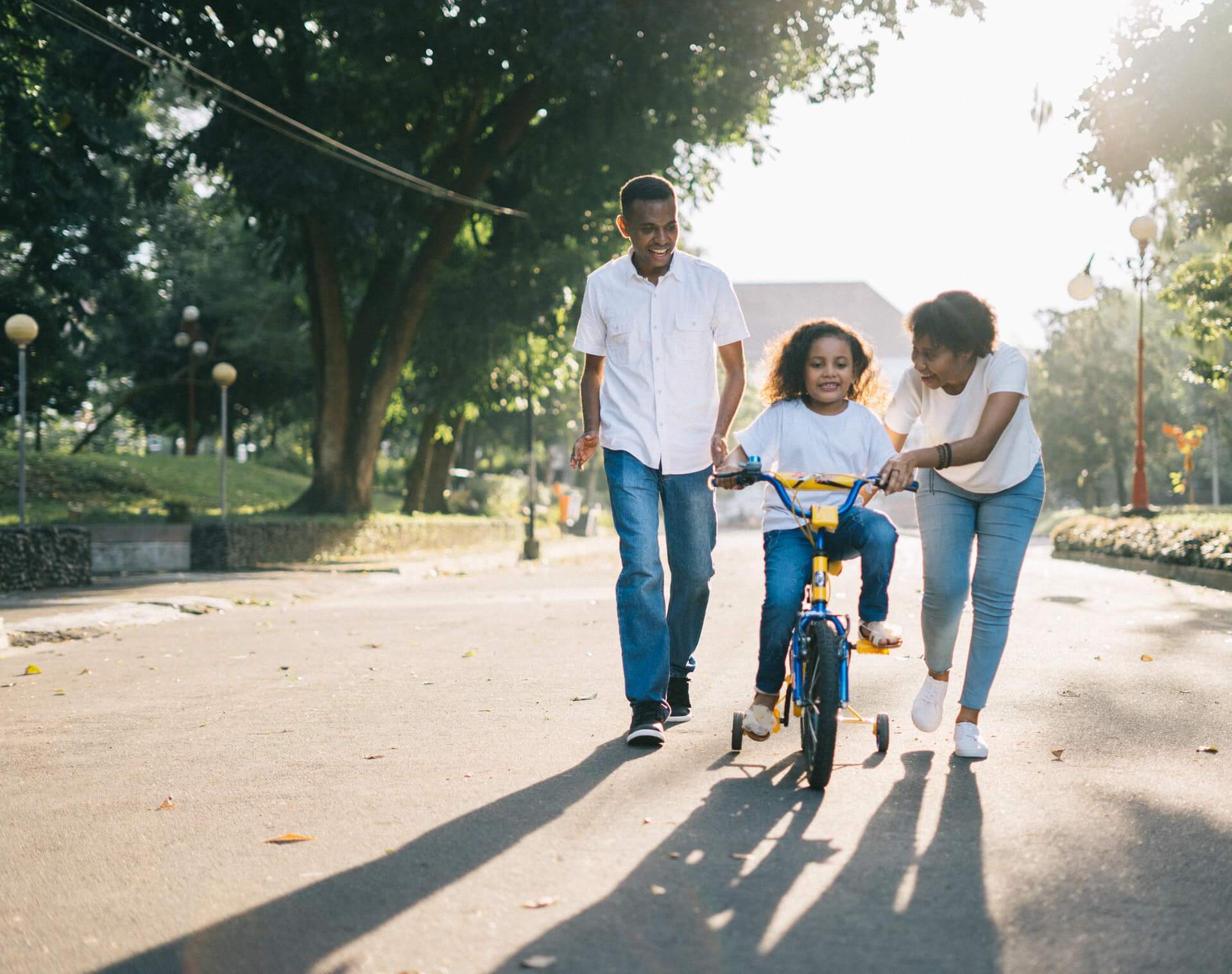 Parents child learning bike