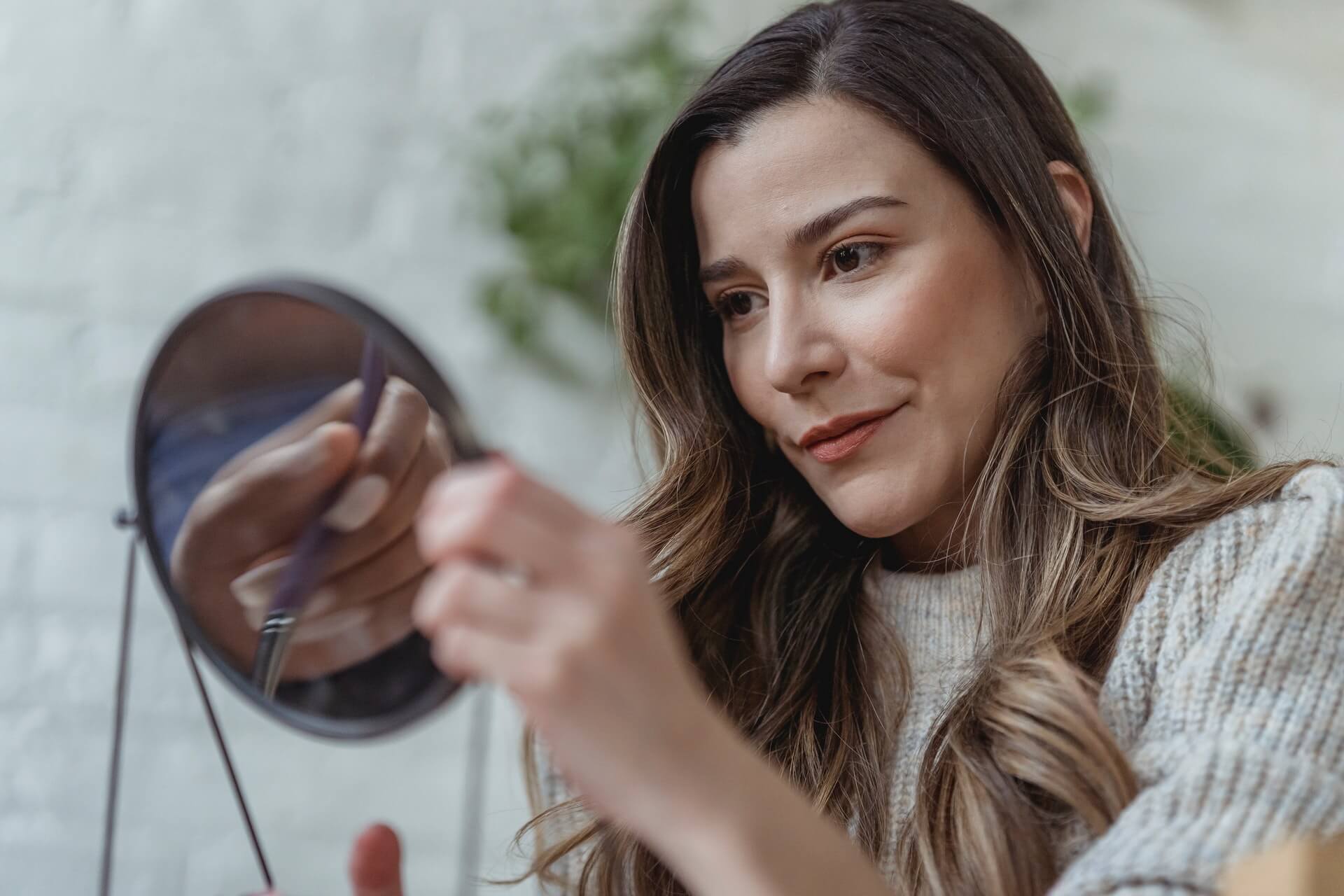 Woman looking in the mirror