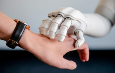 Robot hand touching human hand