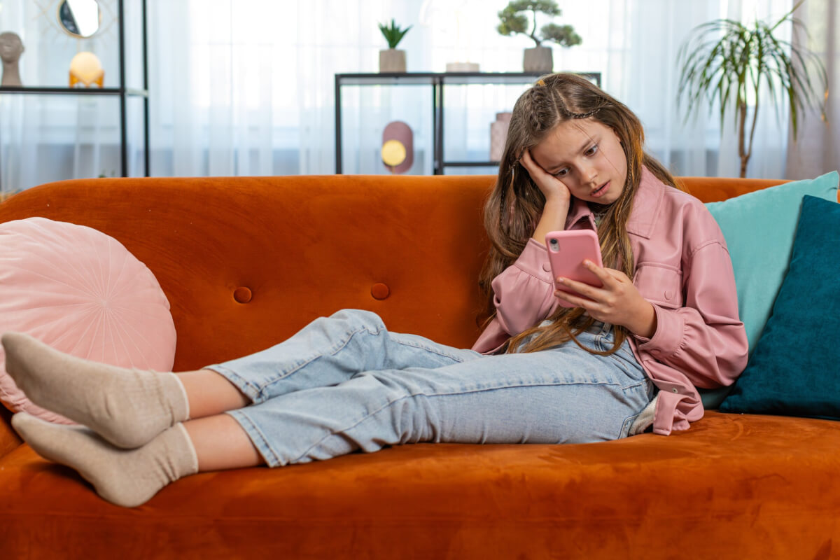 Upset Girl Using Smartphone