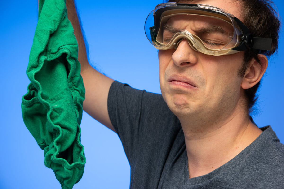 Man making disgusted face at underwear