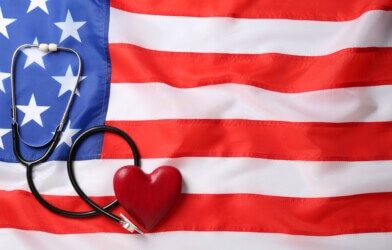 Stethoscope and red heart on American flag