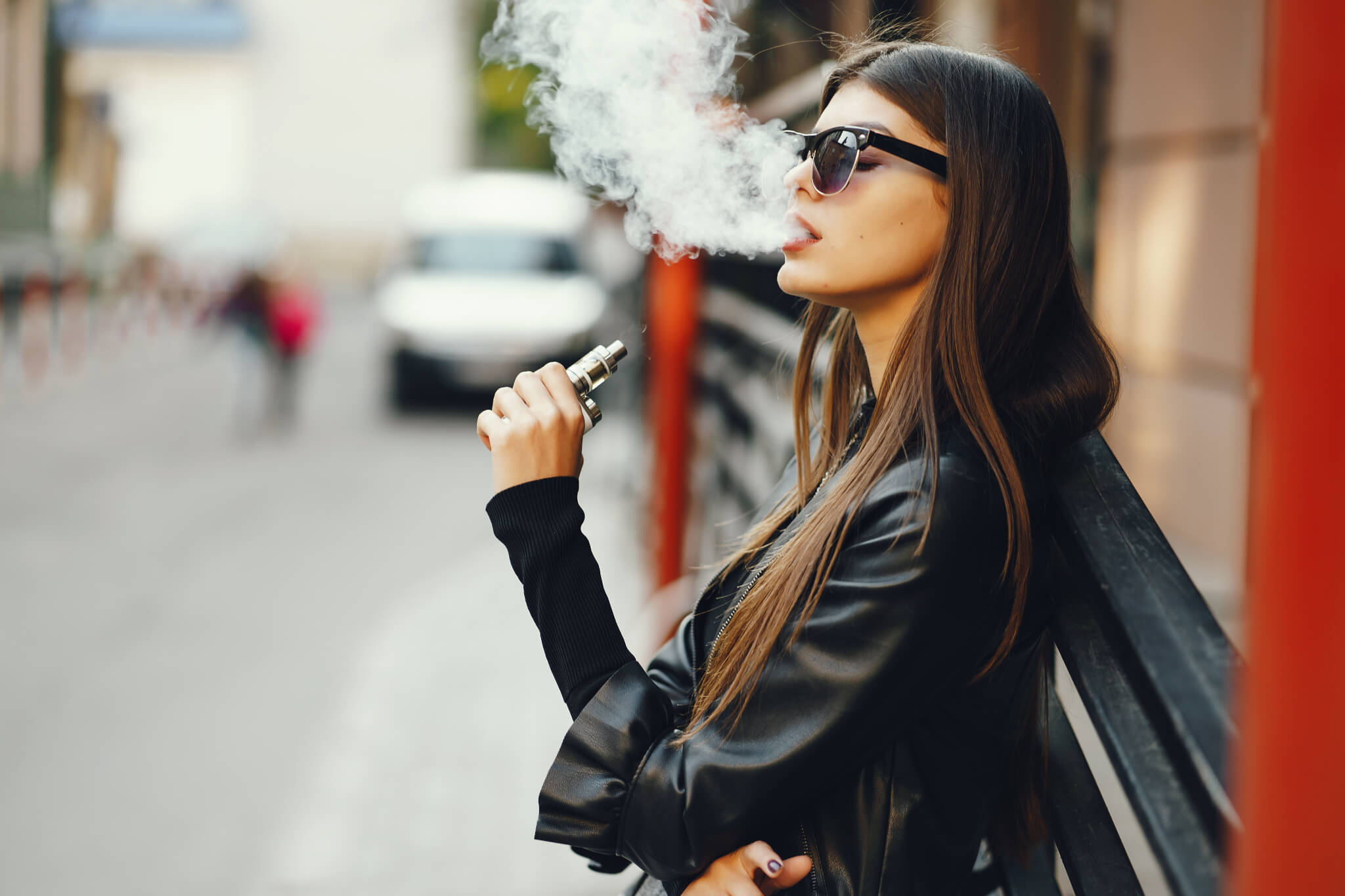 Woman smoking e-cigarette