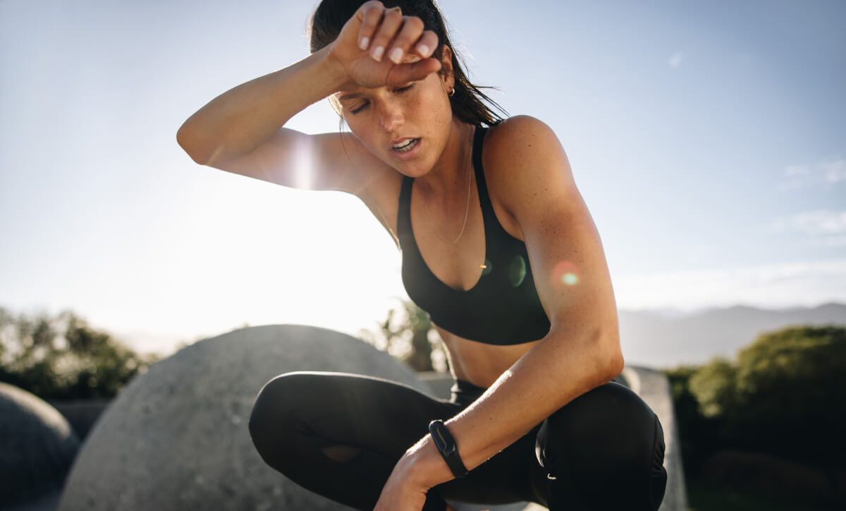 Woman tired and sweaty from long run and workout