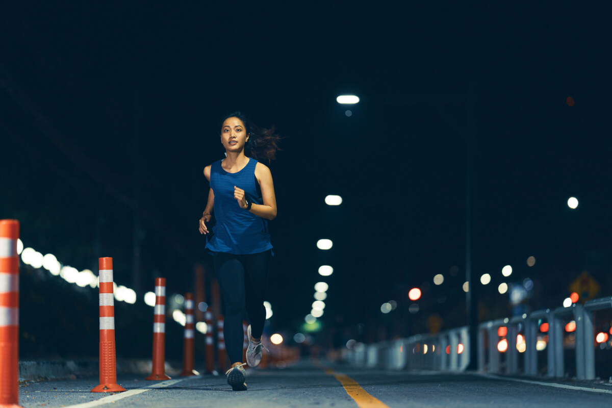 Woman running and exercising at night