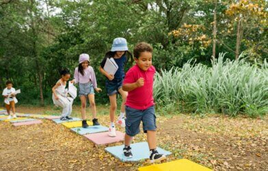 Young children playing outside at a park