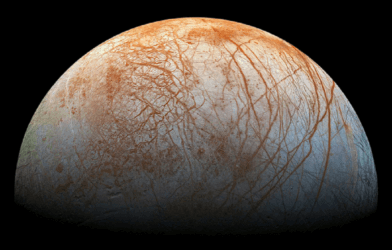 pic of Jupiter's moon, Europa, with red streaks across its surface.